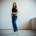 A modern streetwear fashion photo a woman wearing high-waisted Y2K wide-leg dark wash denim jeans, a black crop top, and sneakers. Blurred bokeh effect, gentle soft light, diffused shadows, subtle illumination, sha.webp