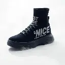 Dreamlike surreal image of a futuristic black high-top sneaker with ribbed knit, thick sole, and bold white and red 'JUST BE NICE – GAME IS RESETTED FOR NEW FUTURE – STARTING NOW' typography.  Sock-fit ankle, detai.webp