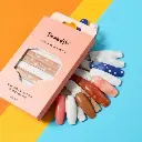 Bright, vibrant colors dominate a low-angle flat-lay of Heyhae Dreaming of You nail strips. The beige and peach box displays celestial designs golden stars, deep blue, marble white, and earthy brown tones.  A mini .webp