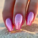 A professional fine art photograph of glazed donut chrome nails with soft pink shimmer, glowing on a beach. Soft dreamy atmosphere, hazy soft light, soft contrast, soft saturation.webp
