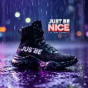 Wet rainy scene depicting a futuristic black high-top sneaker with ribbed knit texture, thick rubber sole, and bold white and red geometric typography 'JUST BE NICE GAME IS RESETTED FOR NEW FUTURE STARTING NOW'. Vi.webp