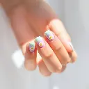 Gentle soft light, soft dreamy atmosphere. Minimal pastel French tip nails with daisy accents soft baby blue, lavender, mint on short almond nails. Summer daylight background, hazy, soft light, diffused shadows, su.webp