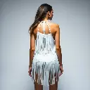 A backless halter neck white fringe mini dress, layered fringe, sleeveless, deep neckline, festival cowgirl fashion, on a white studio background. Futuristic sci-fi style, high contrast low key lighting, deep shado.webp